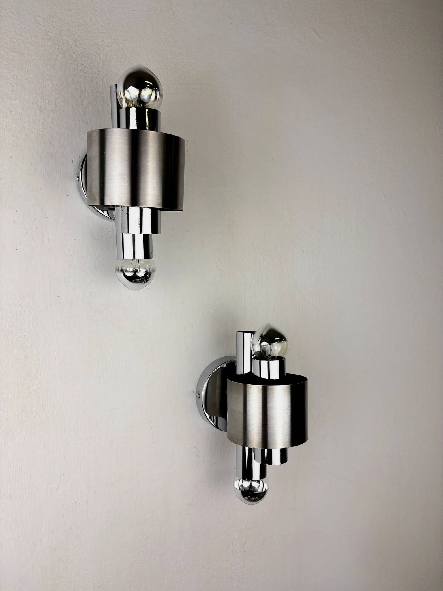 Pair of space age 2-light wall sconces, chromed metal, Italy, 1970s