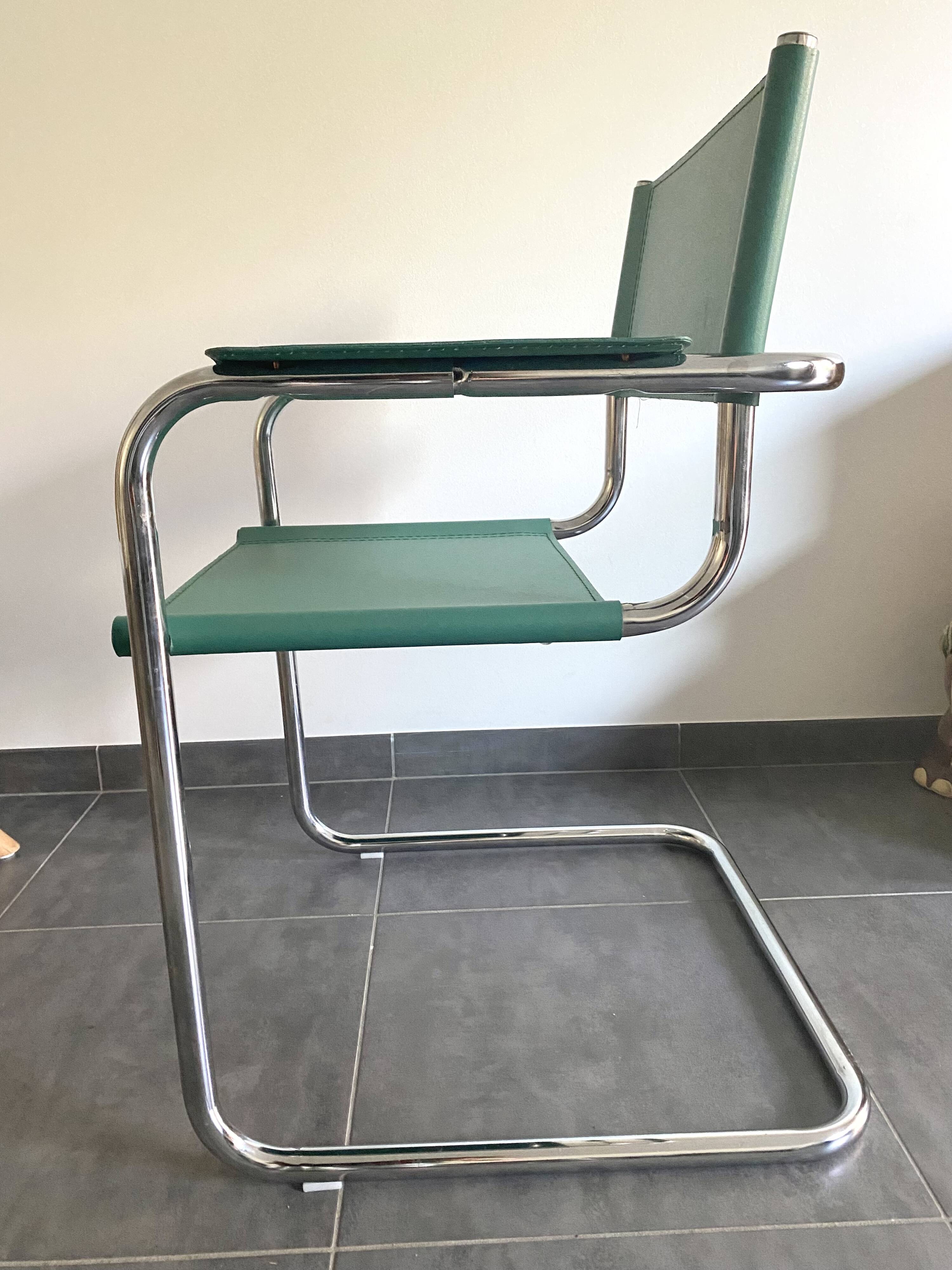 Pair of faux leather and chrome armchairs