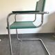 Pair of faux leather and chrome armchairs