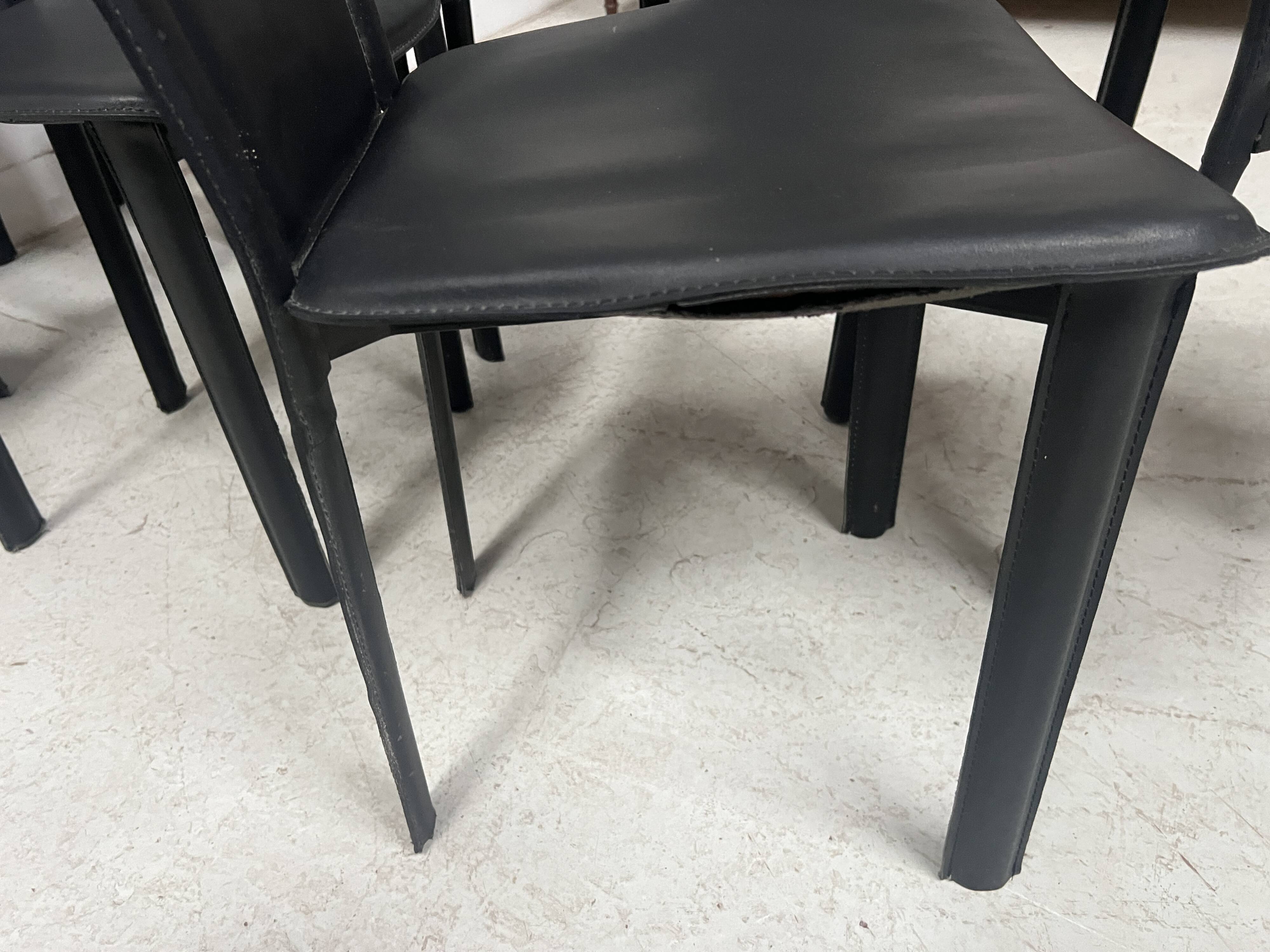 Set of eight designer chairs in black leather from the 20th century