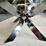 A chrome-shaped table and a 70s glass tray