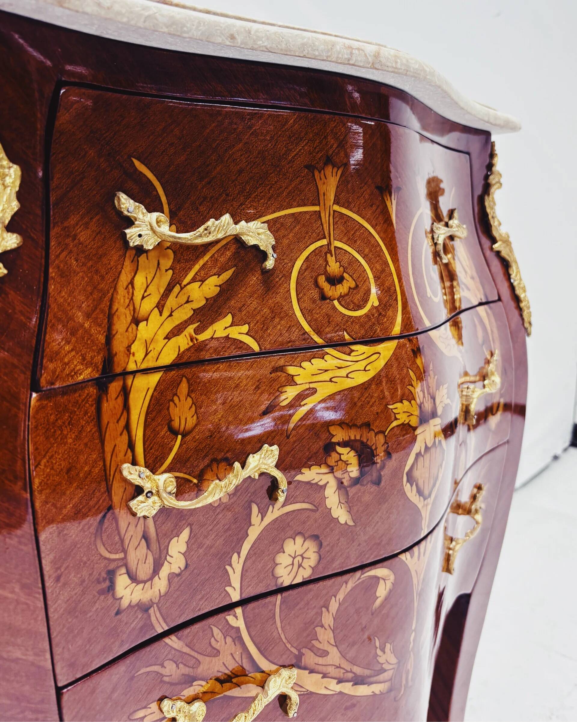Marquetry chest of drawers with marble top in Louis XV style