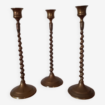 Set of three brass candlesticks