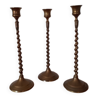 Set of three brass candlesticks