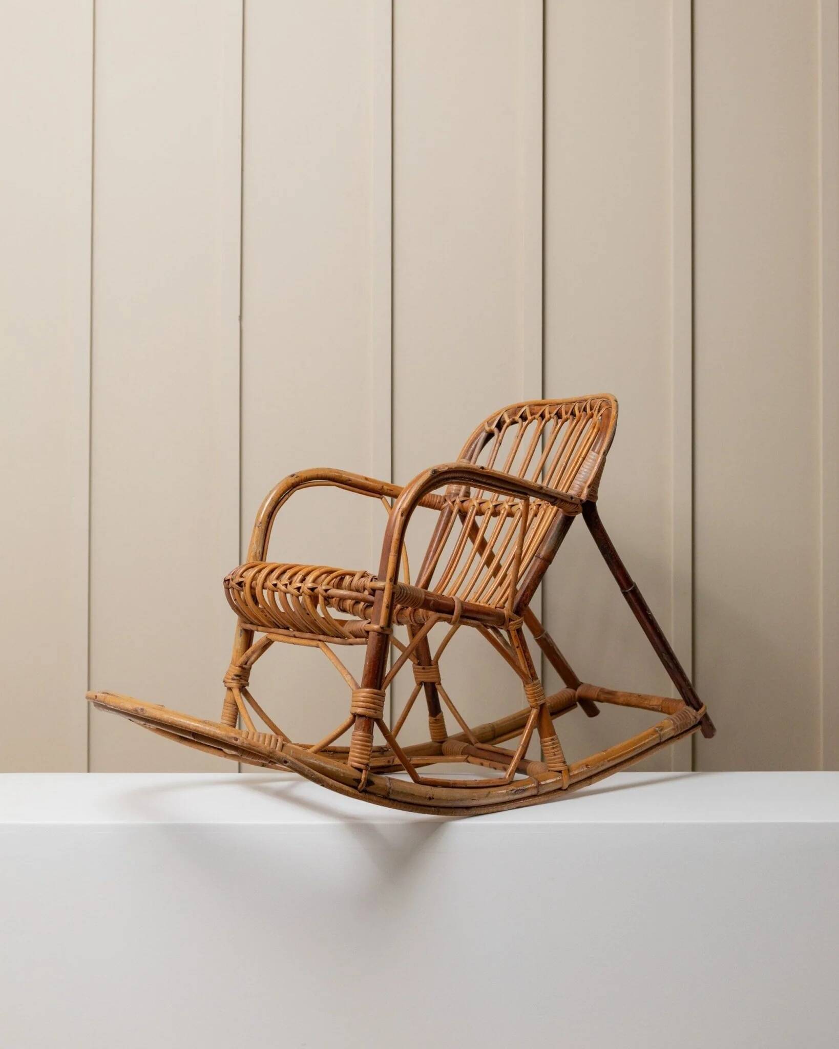 Vintage bamboo rocking chair for children - warm honey-brown cane with rattan frame, Boho mid-century Italian design (1970s)