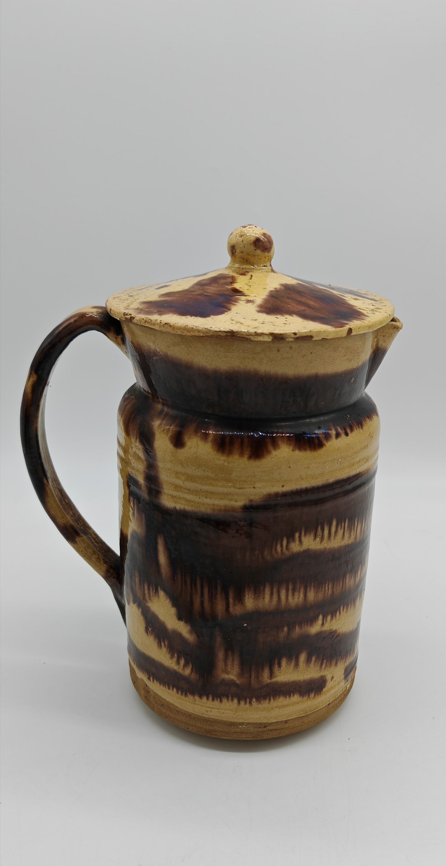 Pitcher covered in glazed earth old french tabby dishes