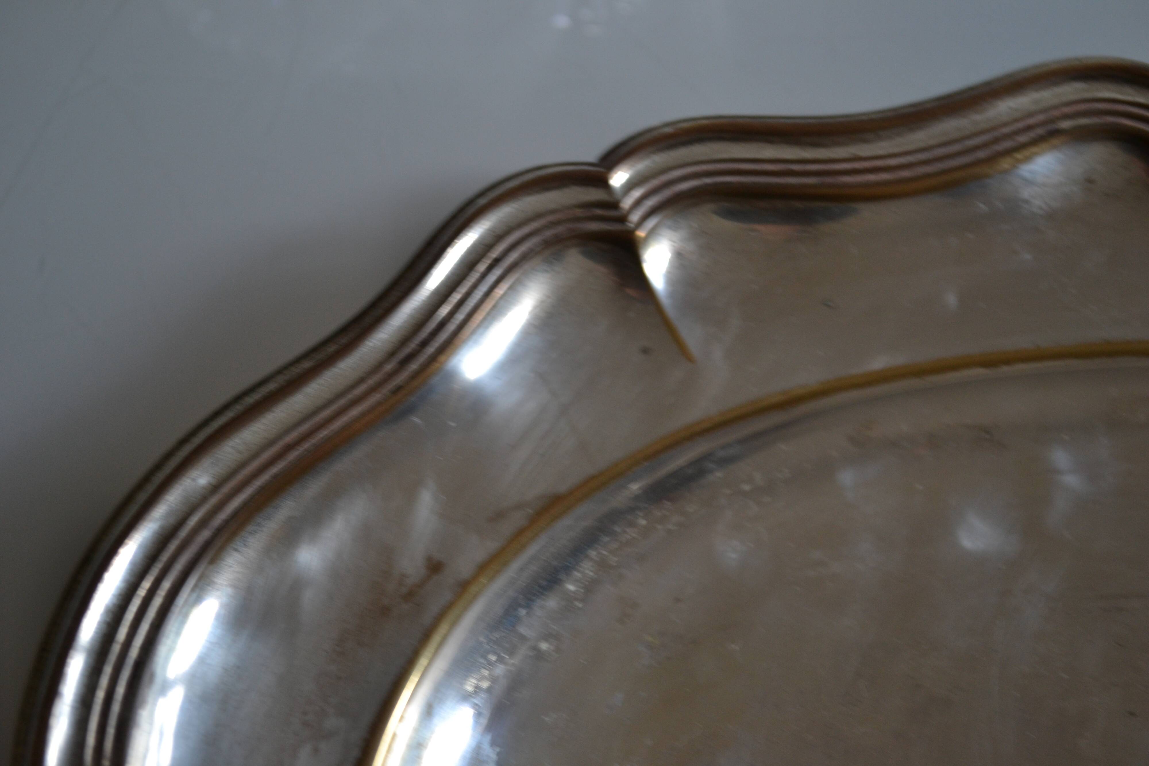 Silver-plated metal aperitif serving tray with HKE hallmark and glass.