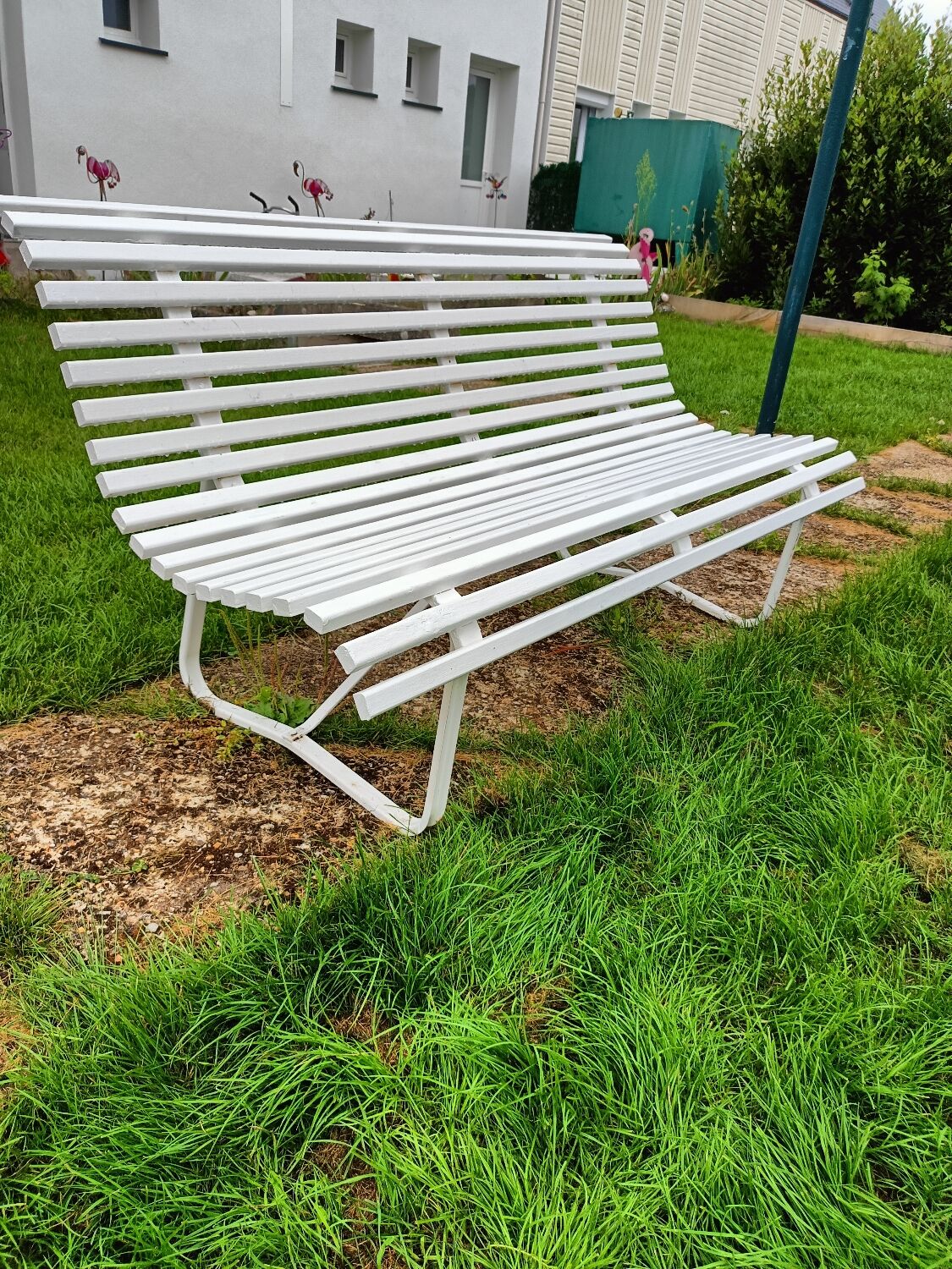 Antique garden bench with metal legs