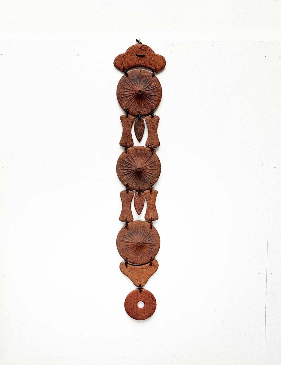 Wall suspension of Danish studio pottery in mid-century brutalist modernist style by Clara Helmich, 1979.