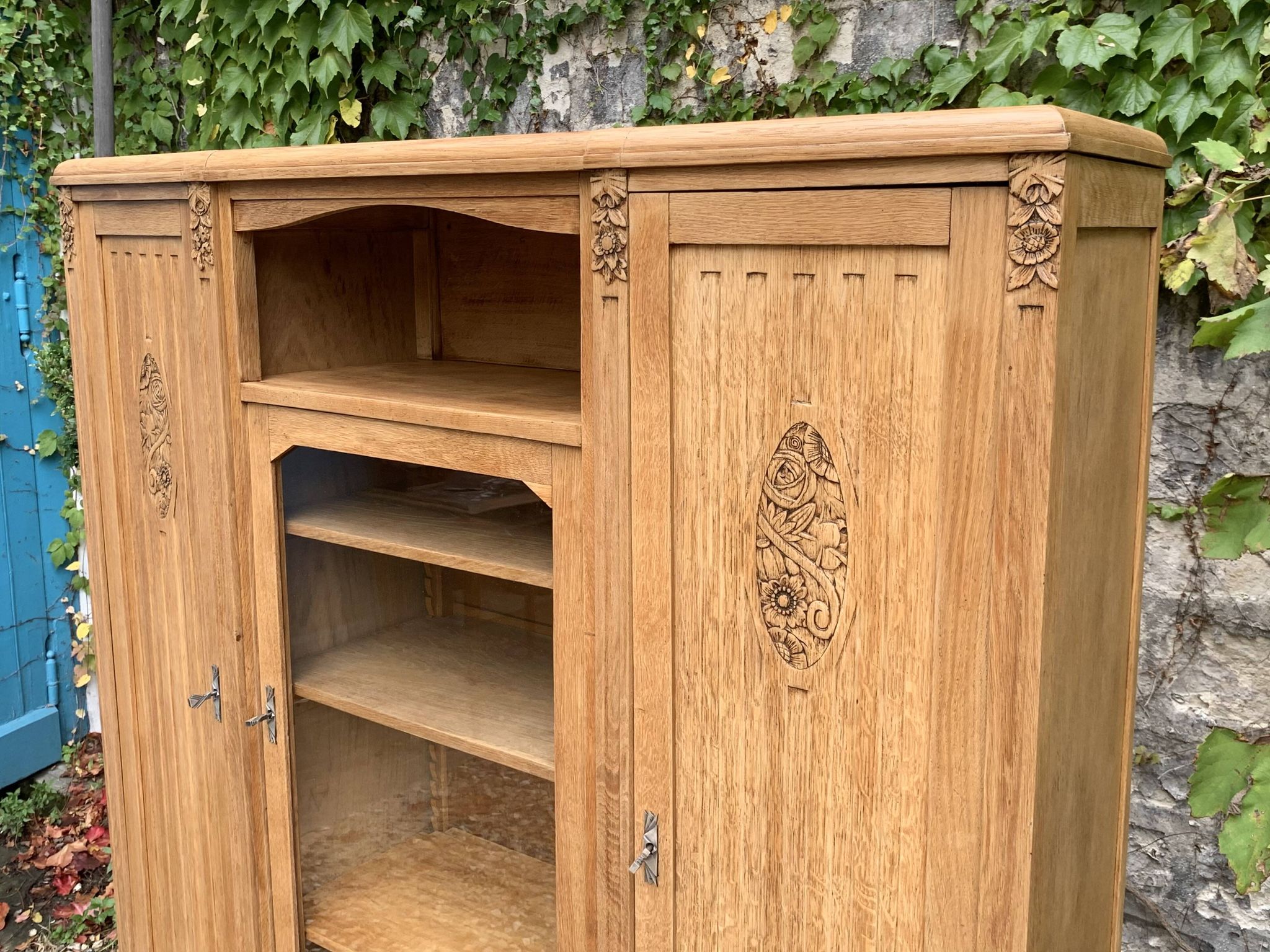 Asymmetrical Art Deco glass-fronted Parisian wardrobe in raw oak, 1930.