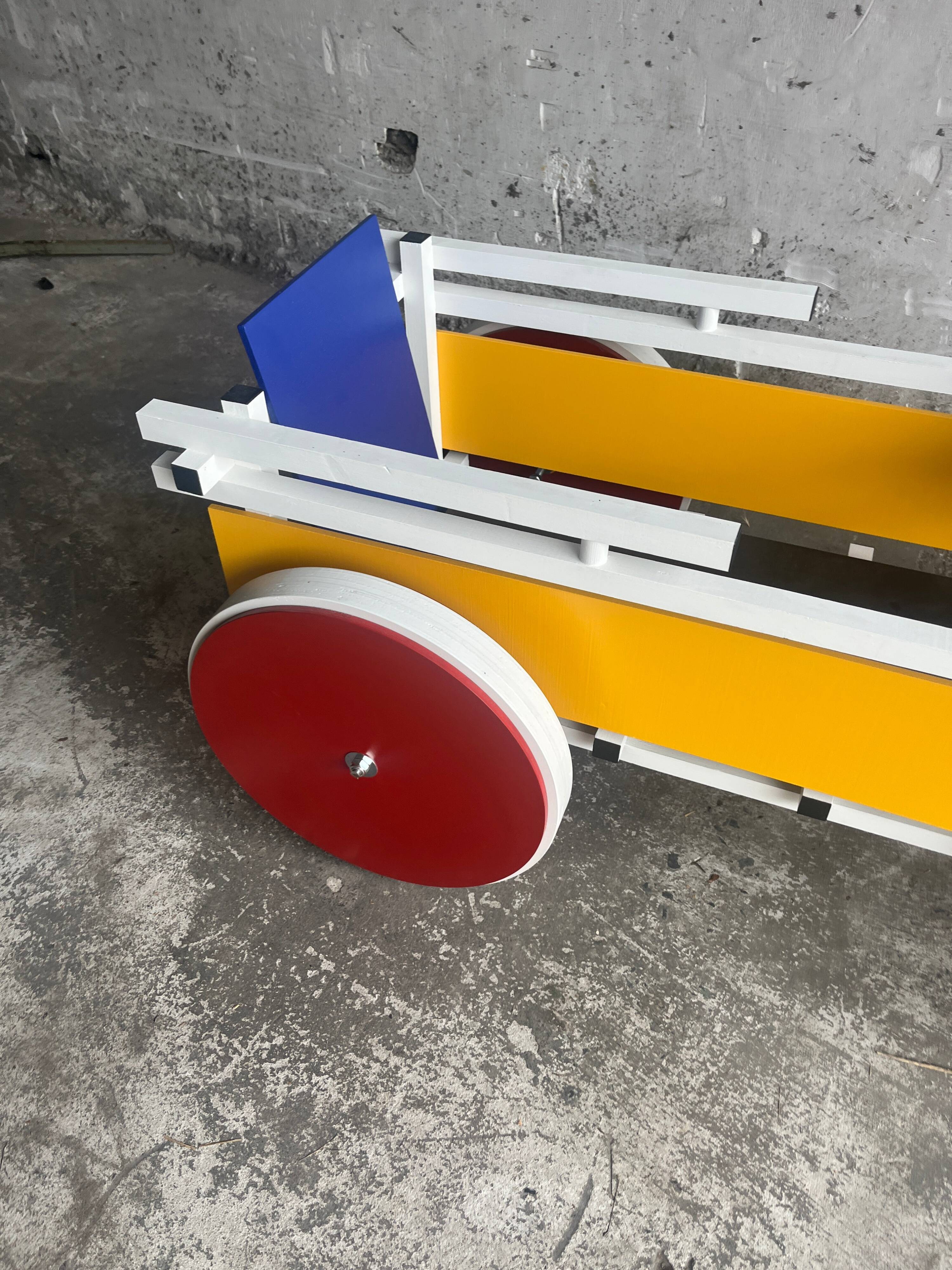 Rietveld-style De Stijl handcart in painted wood — white frame with red, blue, yellow accents