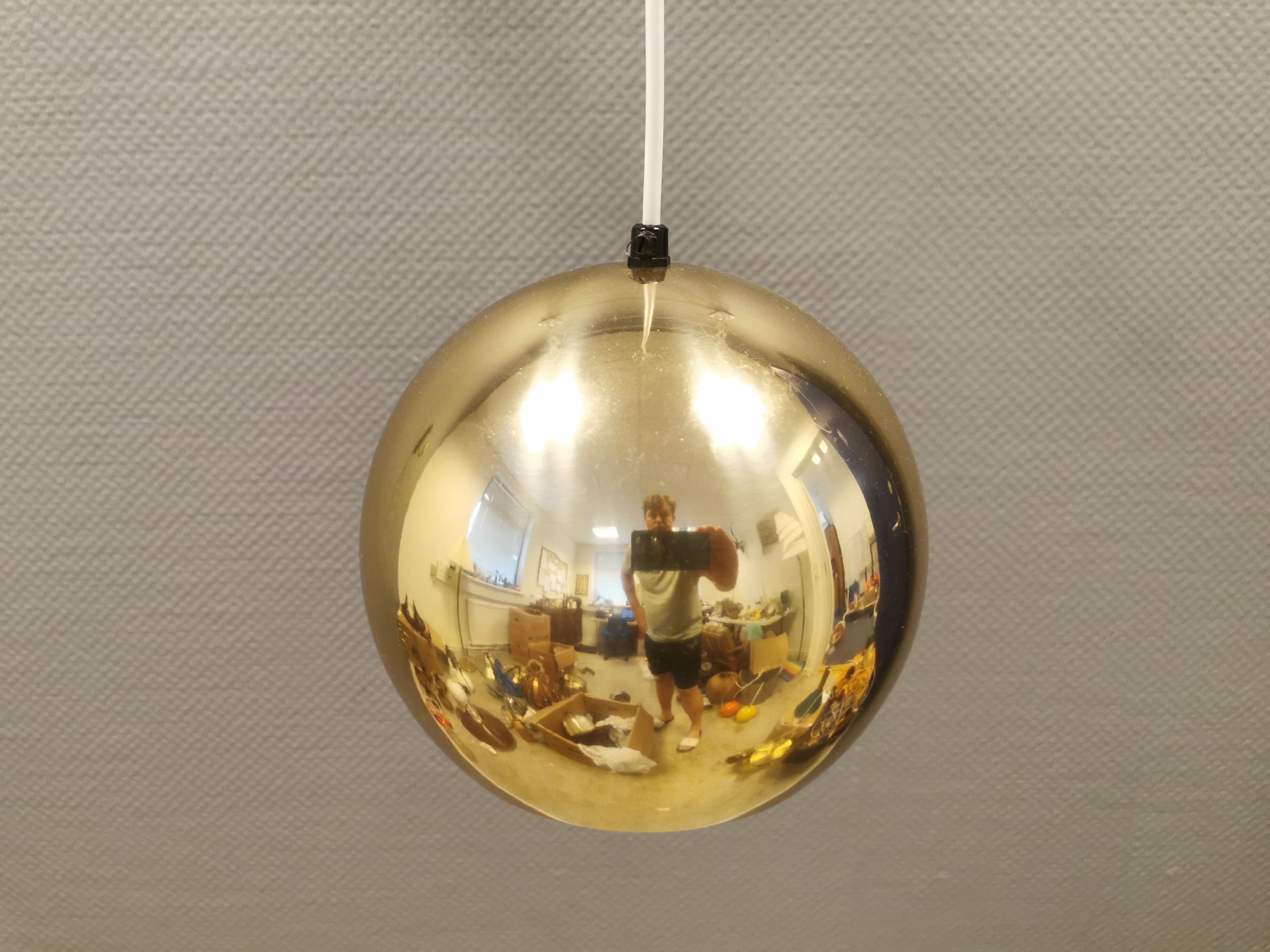 Danish ball lamp from the 80s, in gold colored lacquer.