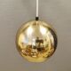 Danish ball lamp from the 80s, in gold colored lacquer.
