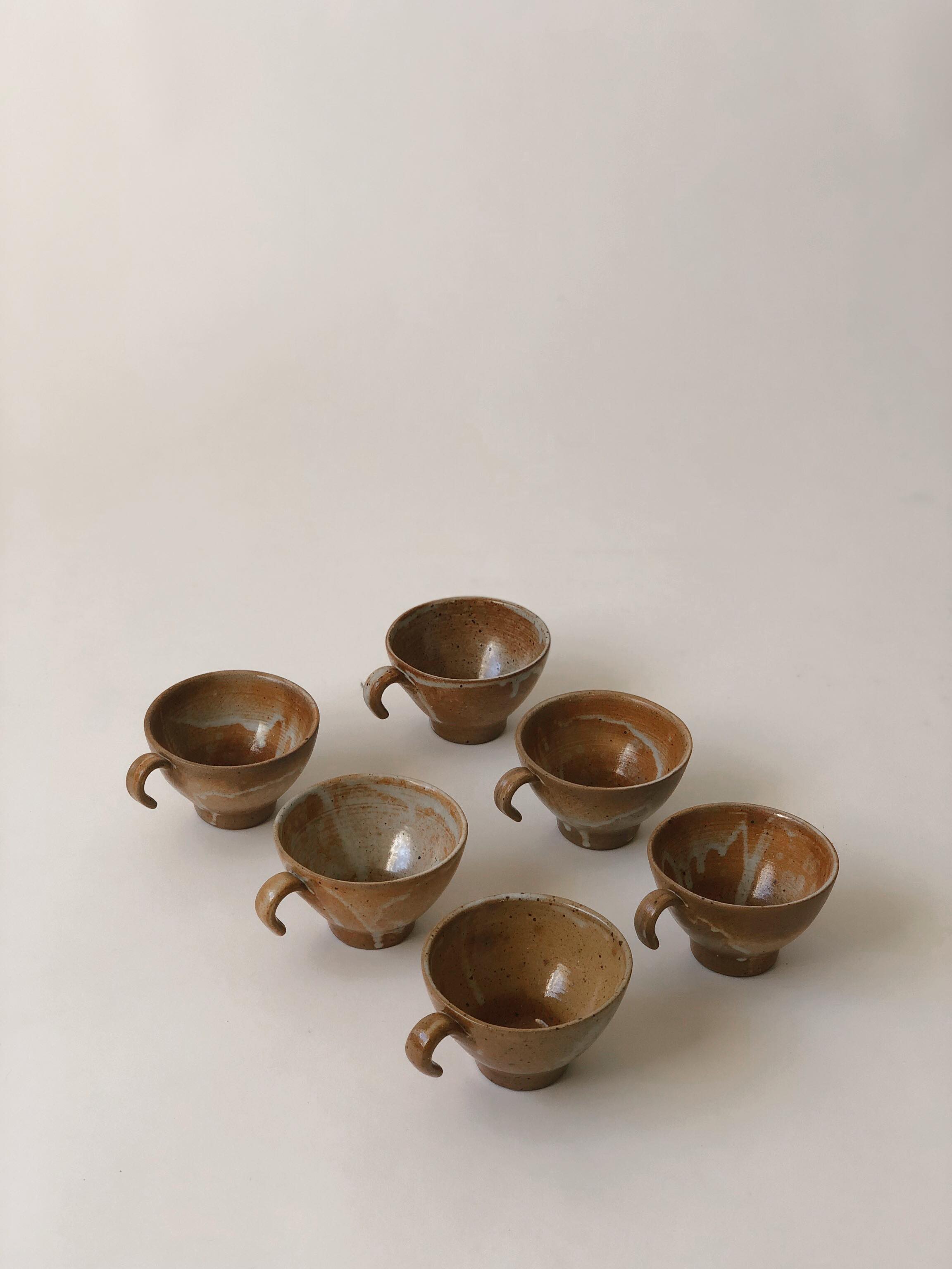 Suite of 6 sandstone cups