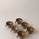 Suite of 6 sandstone cups
