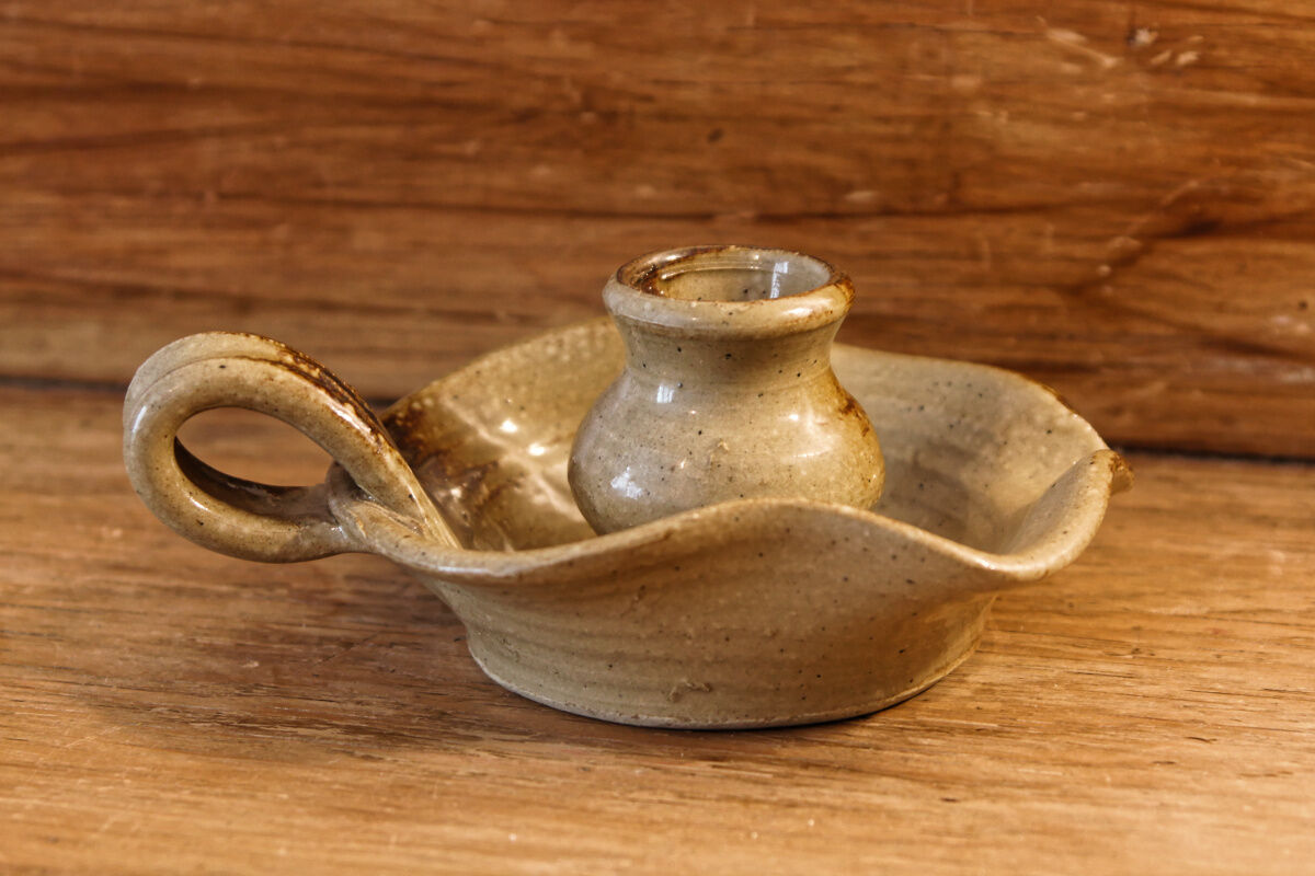 Signed sandstone candle holder
