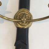 Pair of Black Lacquered Bronze Wall Lamps with Lions' Head Decorations. Around 1970