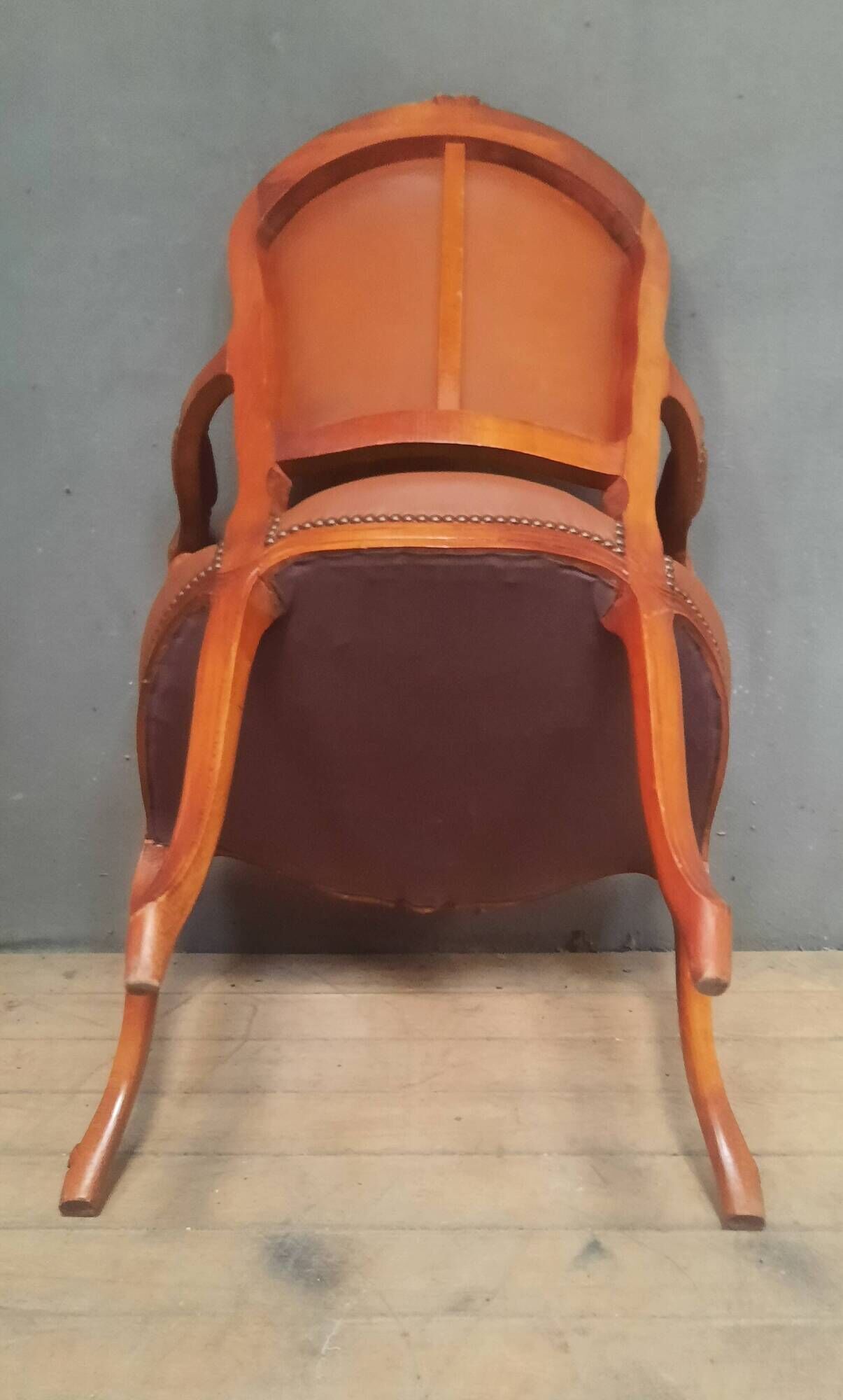 Louis XV style armchair covered in leather.