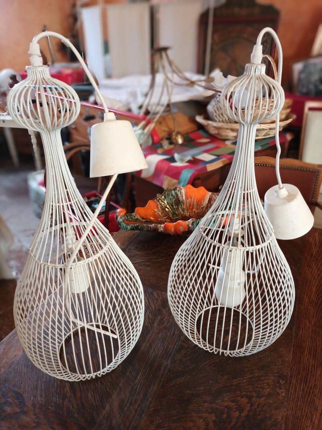 Pair of white metal pendant lights