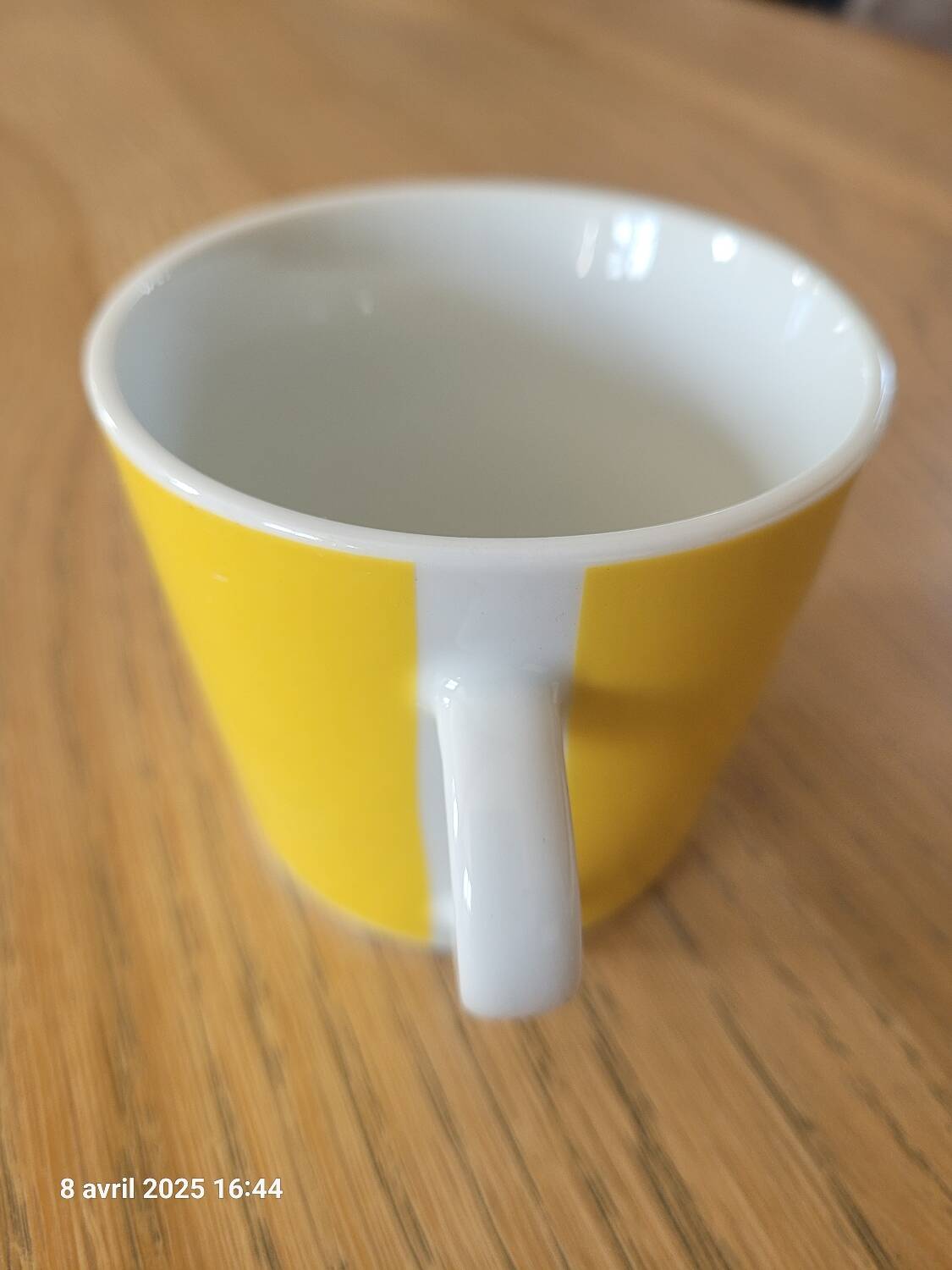 4 yellow and white cups and saucers