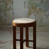 Mid-century Danish stool in oak, reupholstered in boucle wool, circa 1950.