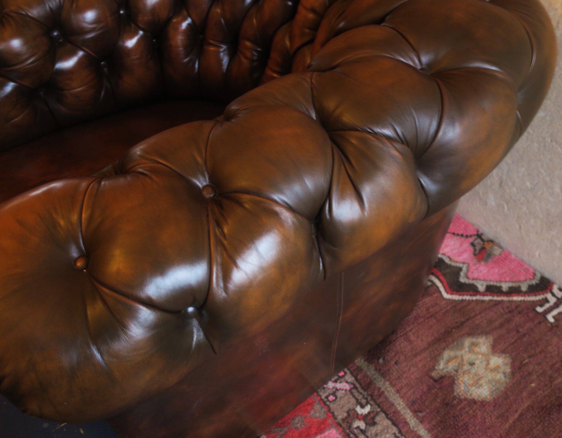 Chesterfield club armchair in patinated chestnut coloured leather