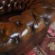 Chesterfield club armchair in patinated chestnut coloured leather