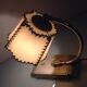 Brass bedside lamp and beige lampshade art deco style