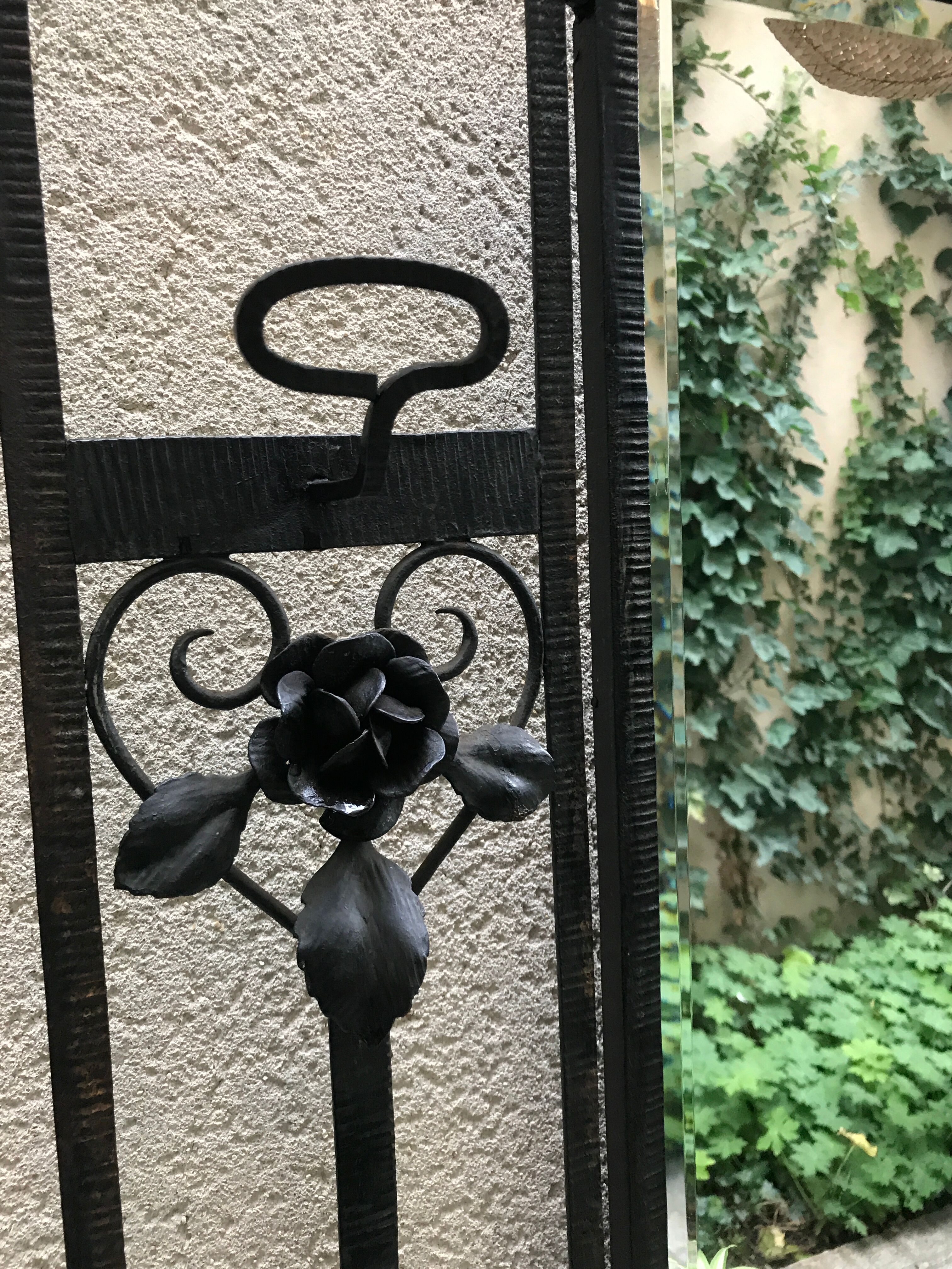 Wrought iron coat holder with 1930