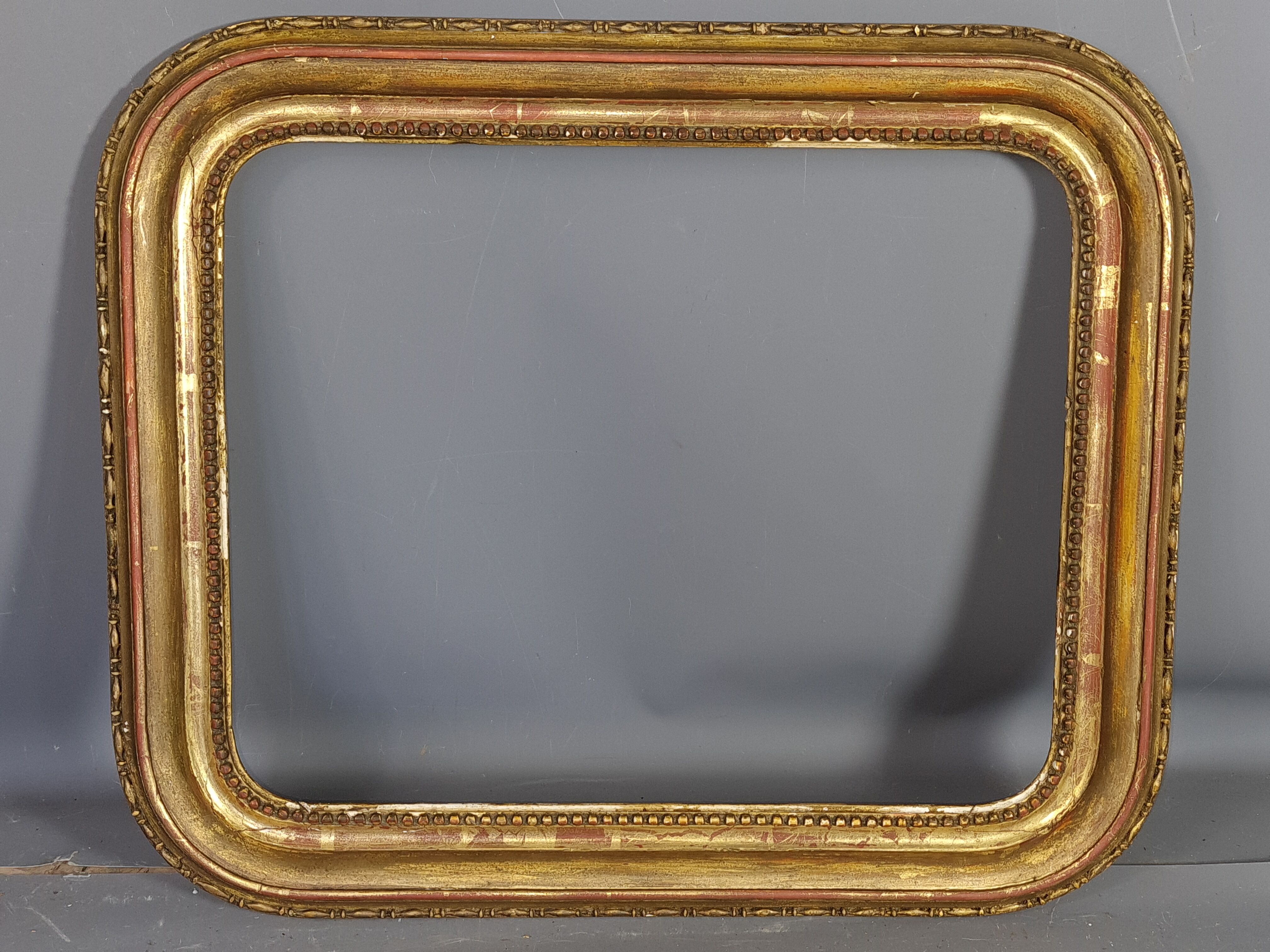 Old frame with doucine gilded stucco wood