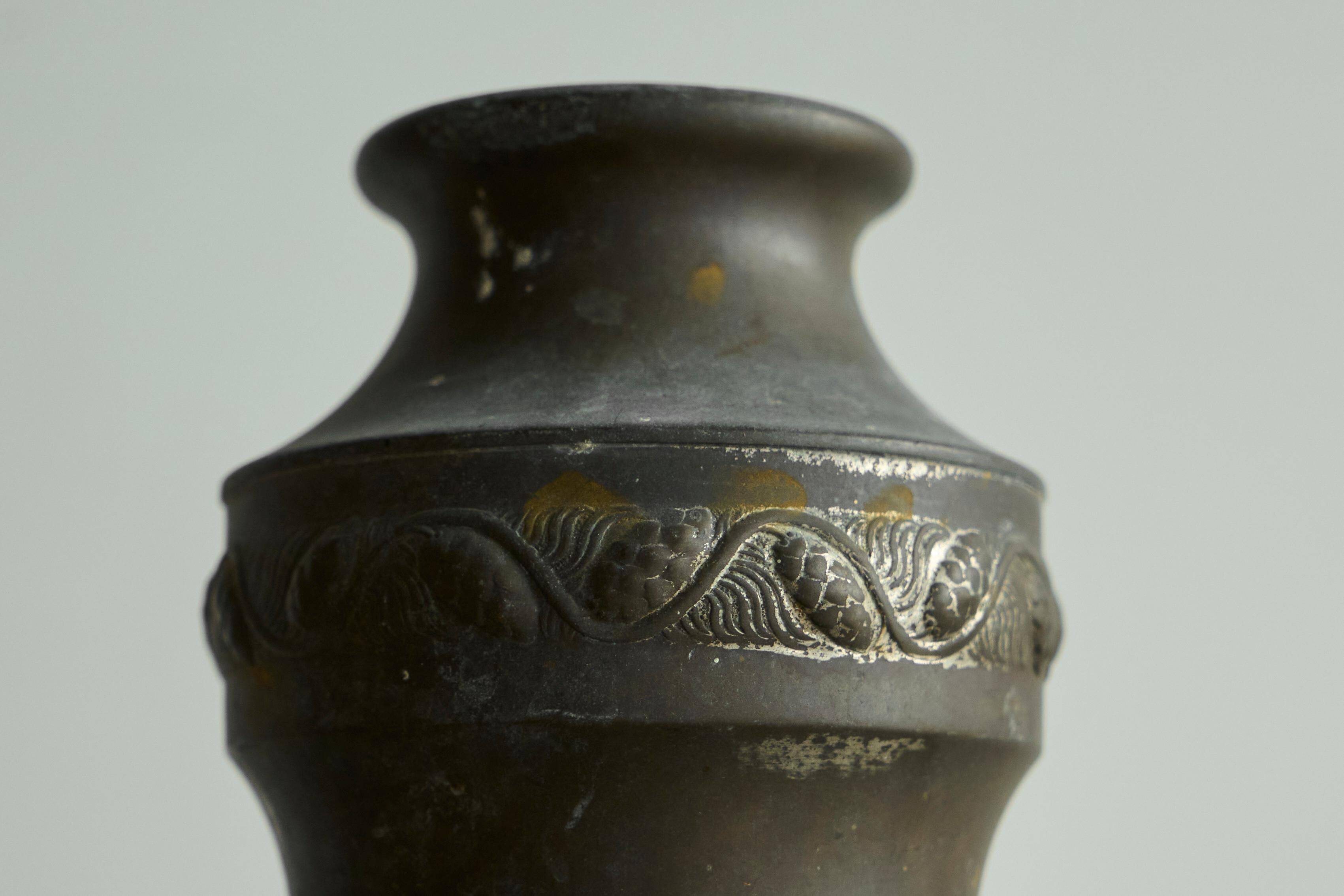Pair of Art Deco vases in patinated metal