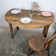 Antique wooden drop-leaf table with turned legs.