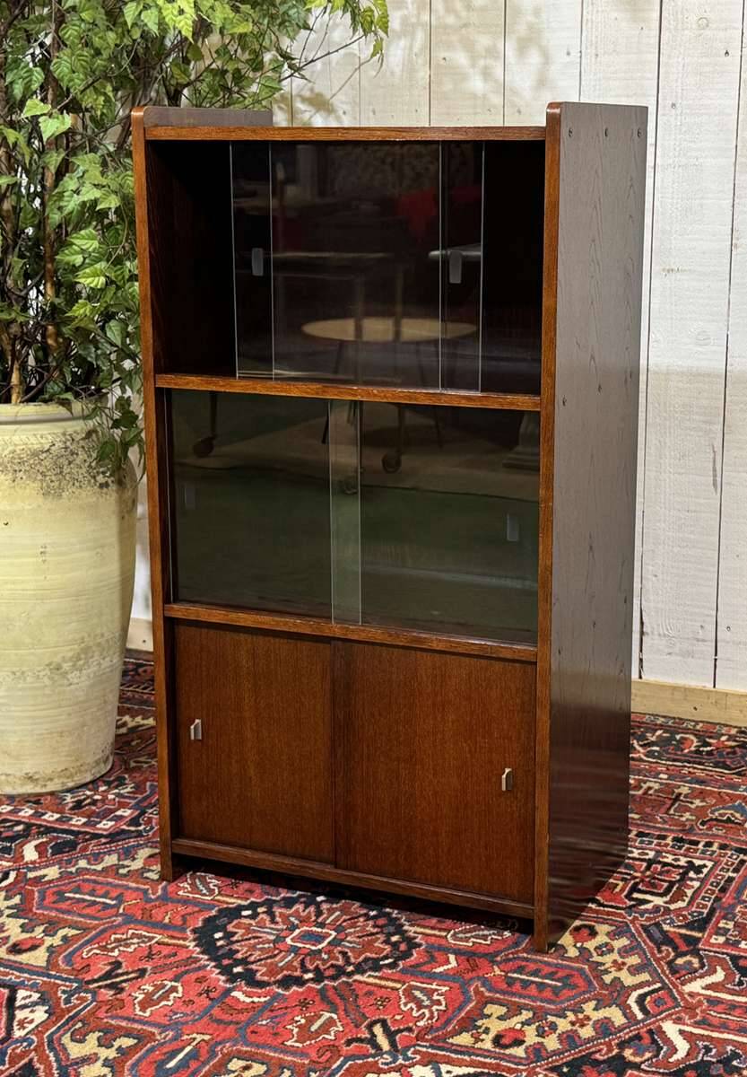 Small English oak library from the 1960s with sliding doors.