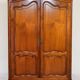 Linen cupboard in cherry wood in Louis XV style with two doors.