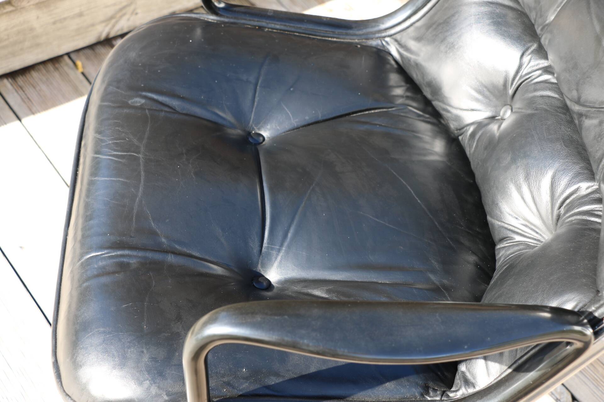 Pollock black leather reclining armchair with fixed ends