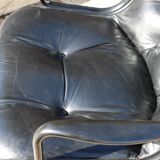 Pollock black leather reclining armchair with fixed ends