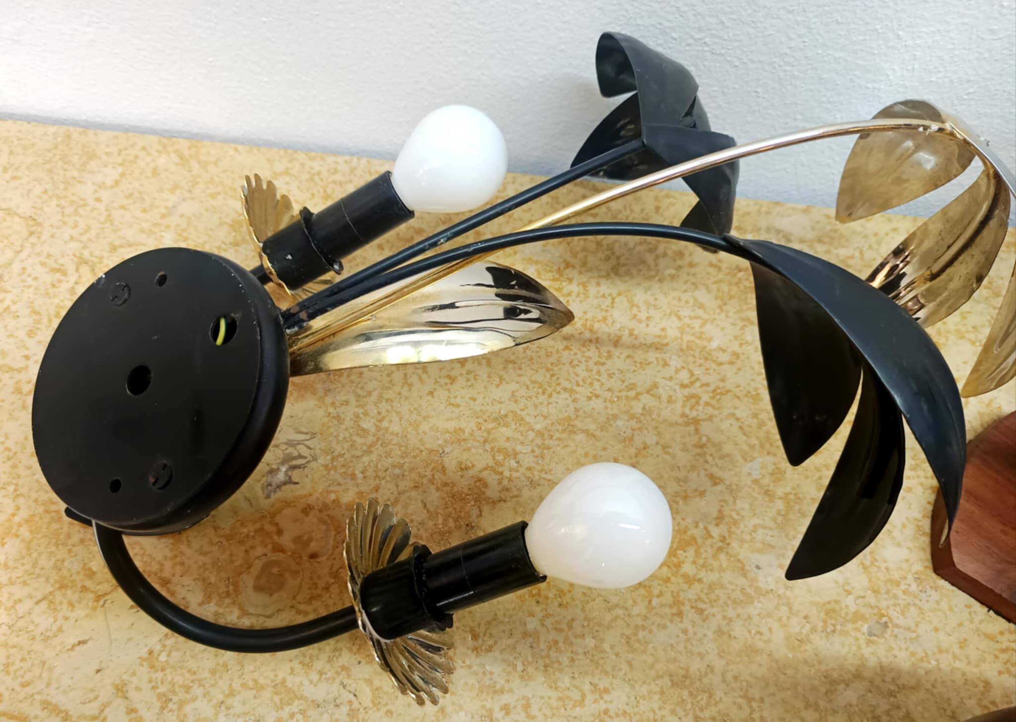 Black and gold Hollywood Regency leaf wall sconce