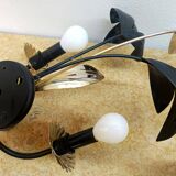 Black and gold Hollywood Regency leaf wall sconce