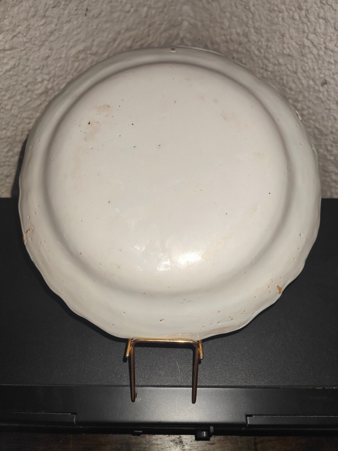 Old plate in earthenware of Nevers eighteenth Century with chantourné edges