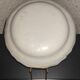 Old plate in earthenware of Nevers eighteenth Century with chantourné edges