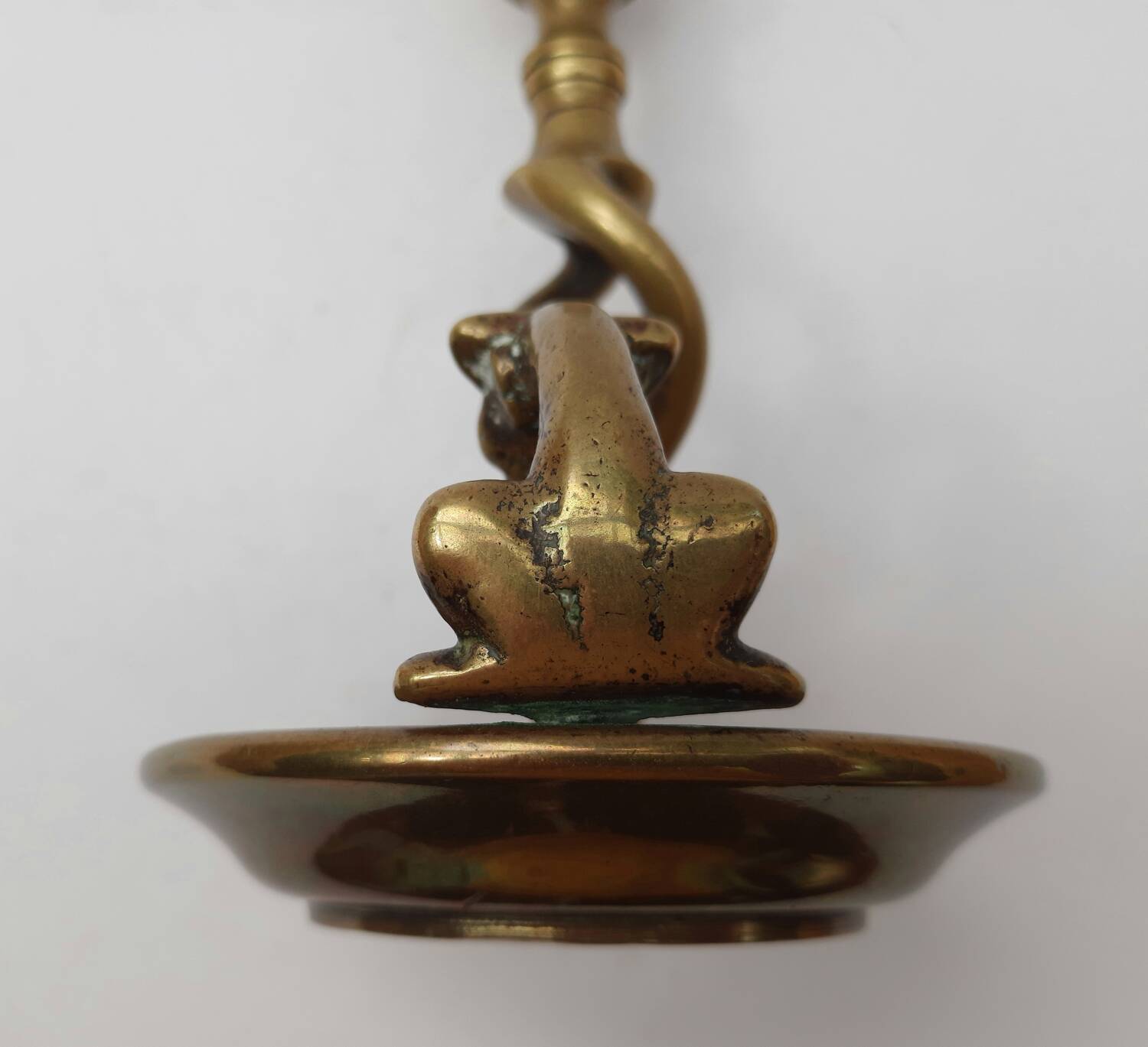 Antique bronze candlestick with dragon-shaped handle from the 17th century