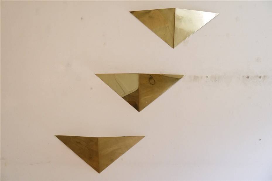 Minimalist brass wall lights