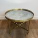 Brass coffee table with a vintage mirror top from the Baguès house.