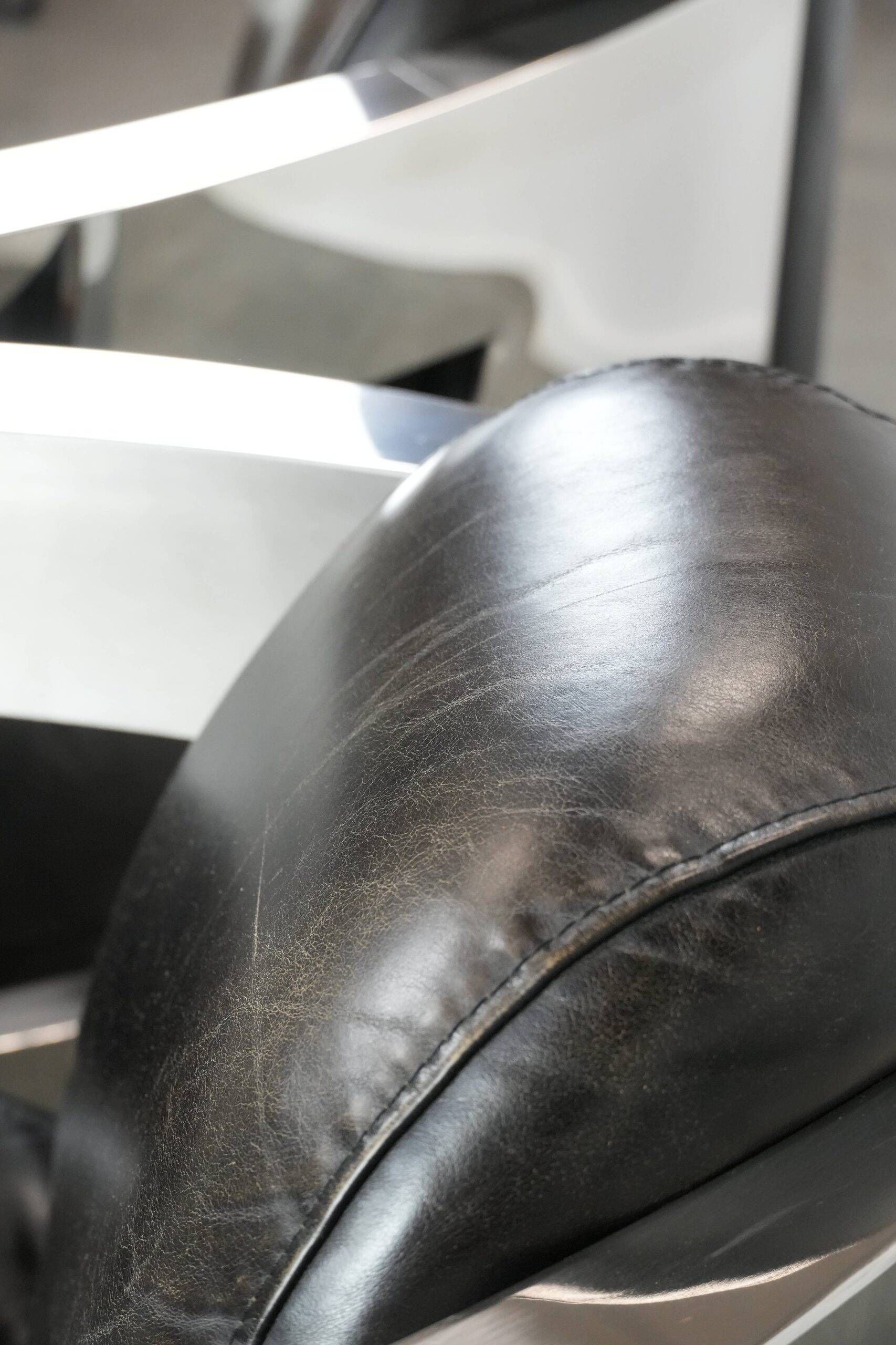 Set of two cowhide leather Aviator design armchairs with aluminium