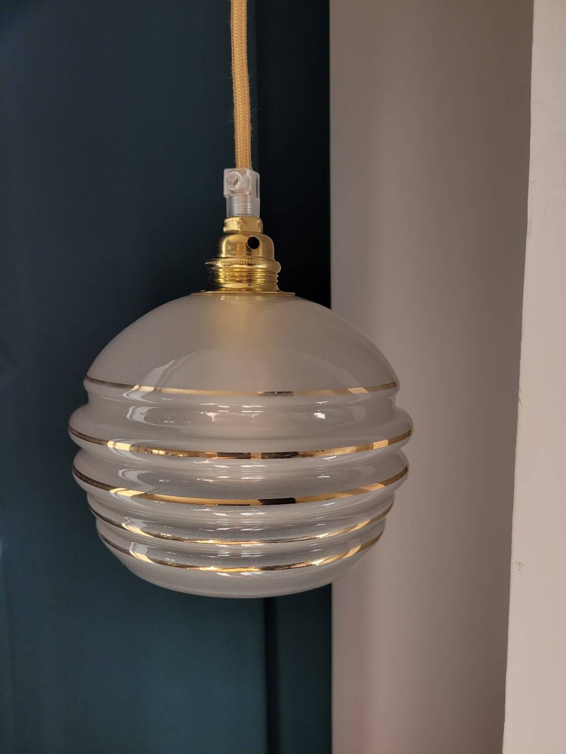 Frosted glass lamp with golden trims