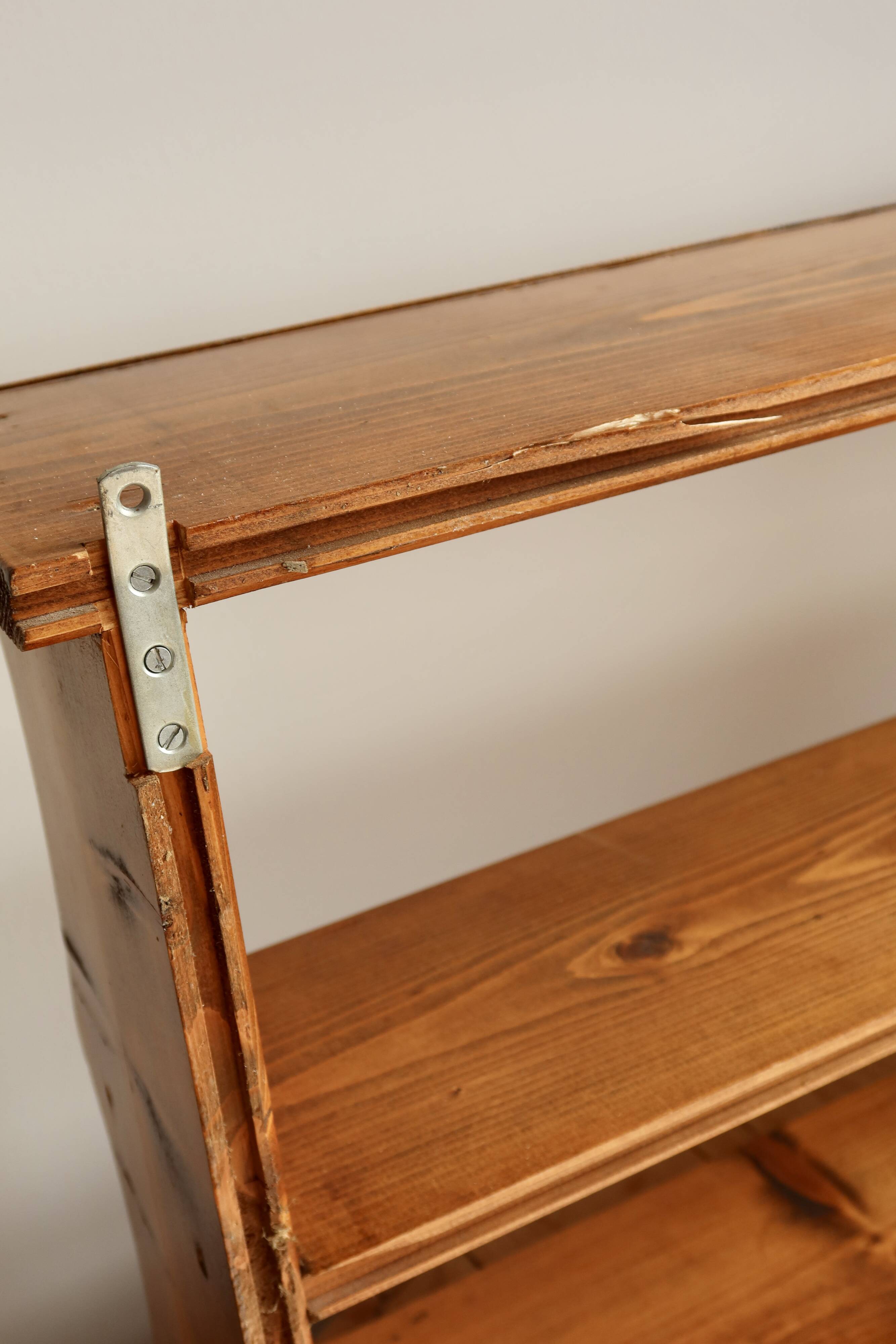 Vintage pine wall shelf with a scalloped front.