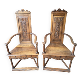 Pair of Renaissance style carved walnut armchairs