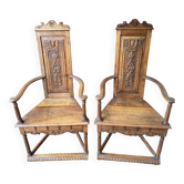 Pair of carved walnut armchairs in Renaissance style