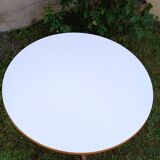 Round table in white formica and wood