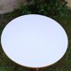 Table ronde en formica blanc et bois